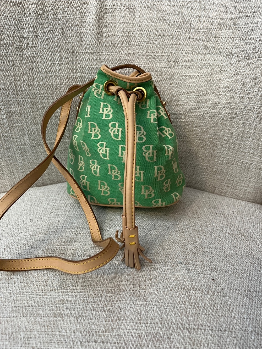 NWOT Dooney & Bourke small monogram green/canvas  bucket bag Leather trim.